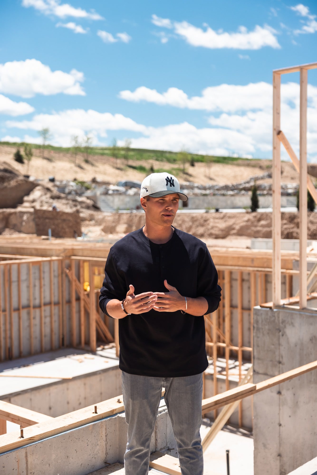 Josh Wilson talking through a plan on site