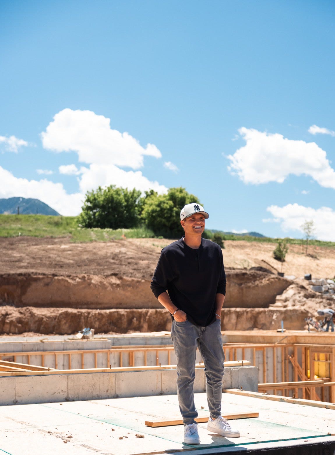 Josh Wilson on the foundation deck of a home under construction